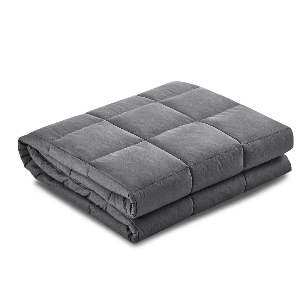 Close-up of soft microfibre cover on 7KG weighted blanket folded on bed.