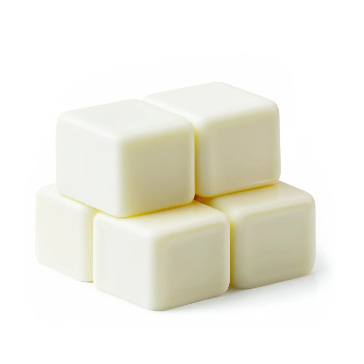 Close-up of various scented wax melts in different shapes and pastel colors.