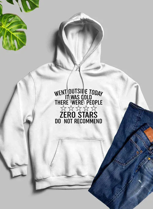 Model wearing black 'Went Outside Today' hoodie with hood up, hands in front pocket.