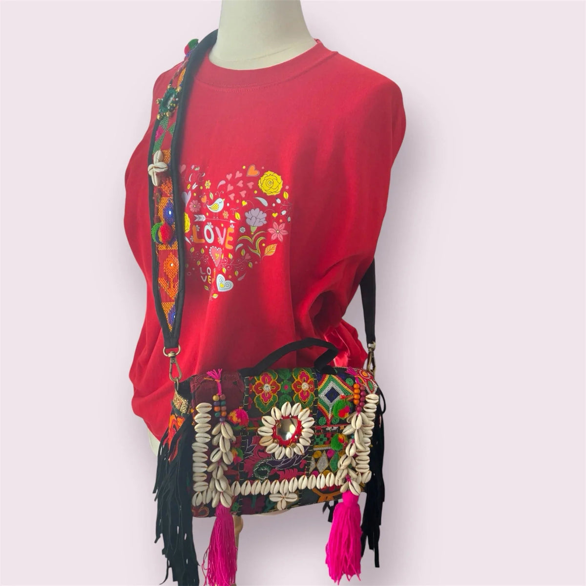 Banjara Boho Sling Bag sitting on surface highlighting detailed bead and sequin embellishments.