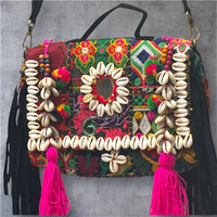 Banjara Boho Sling Bag angled side showing colorful tribal embroidery and shell decorations.