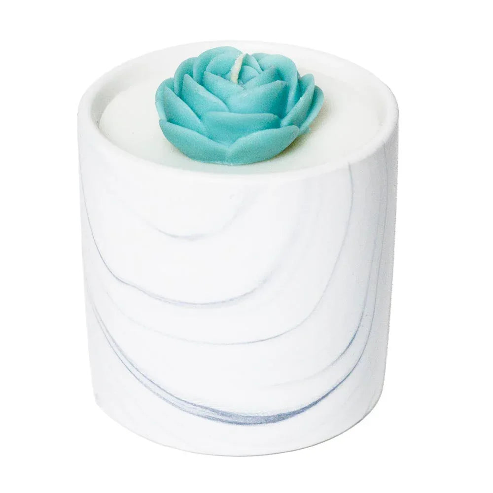 White marble ceramic candle vessel with swirling gray and black patterns displayed on a white background.