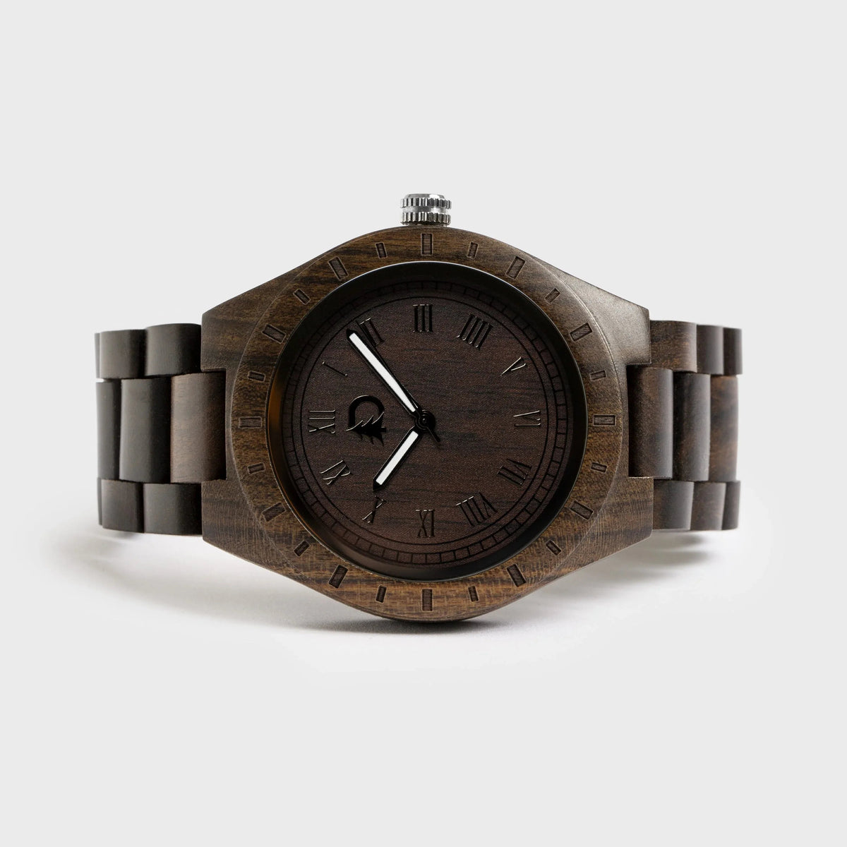 Close-up of men's stylish wood watch featuring black walnut wood face with silver hands and hour markers.