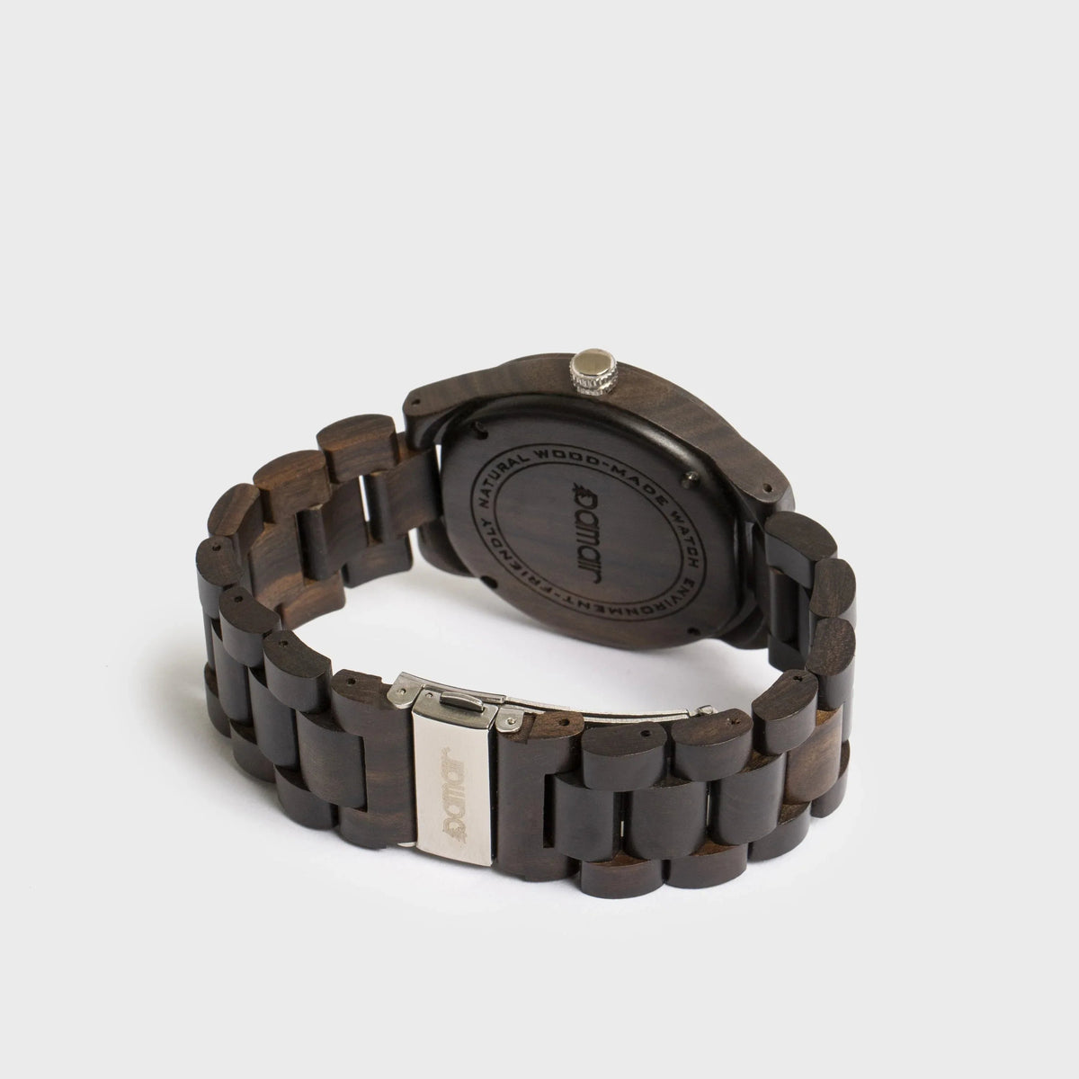 Top view of men's wood watch highlighting black walnut wood dial and silver hour markers.