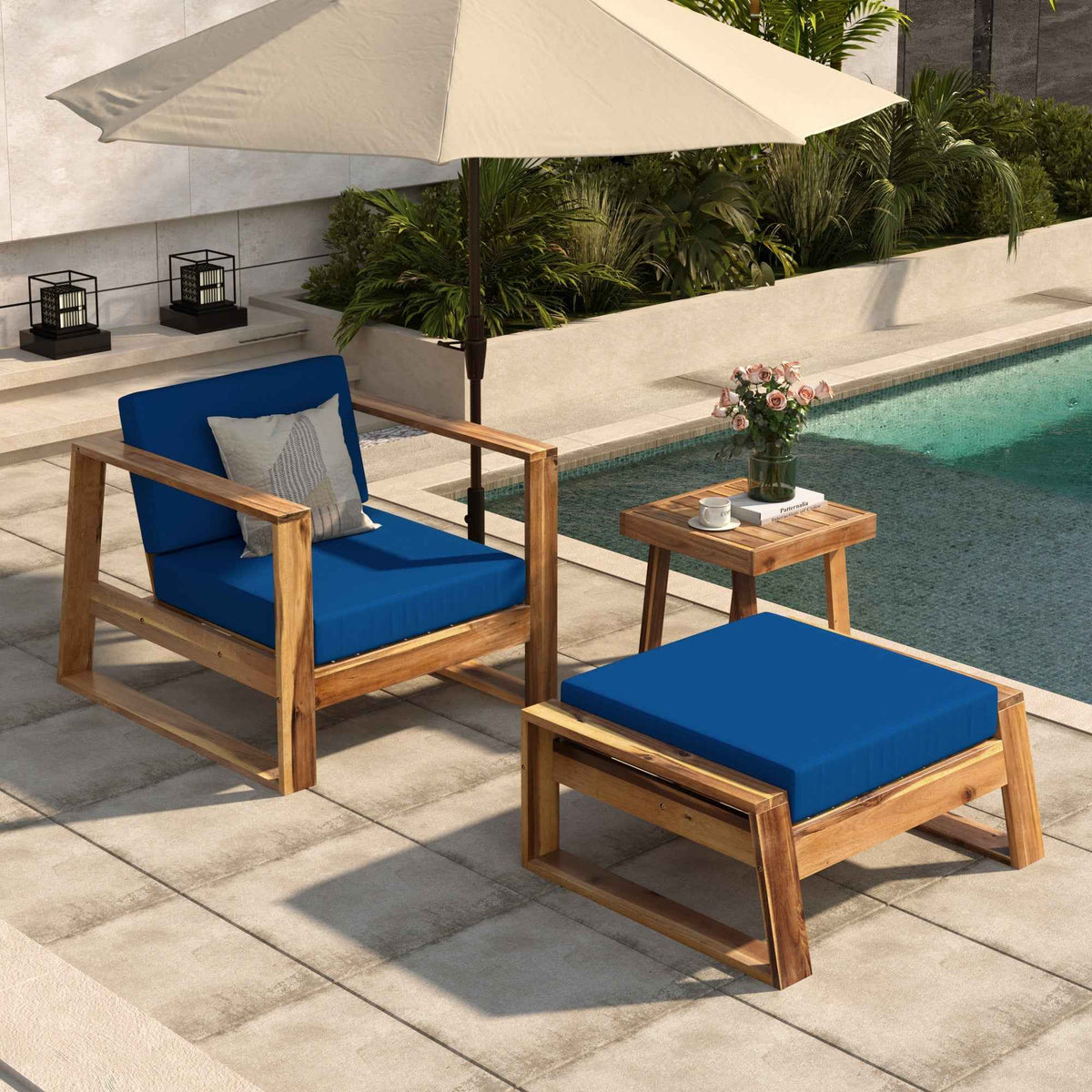 Acacia wood outdoor lounge chair with matching ottoman on patio setting