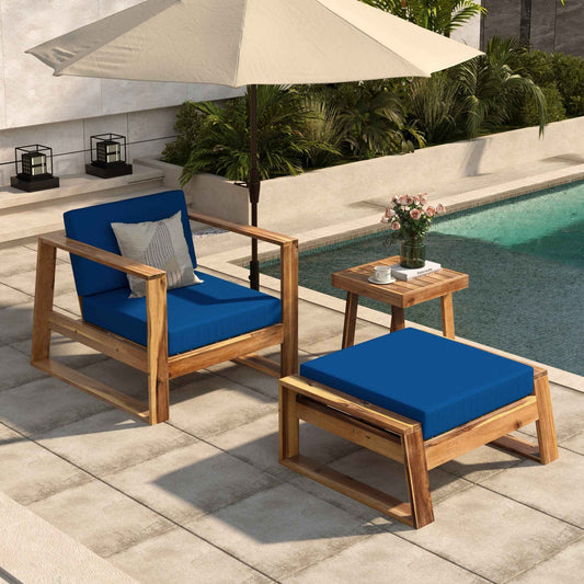 Acacia wood outdoor lounge chair with matching ottoman on patio setting