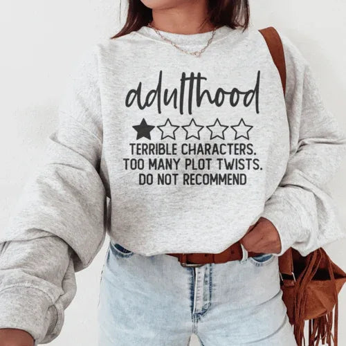 Sport grey sweatshirt with colorful text design stating 'Adulthood Terrible Characters Too Many Plot Twists'
