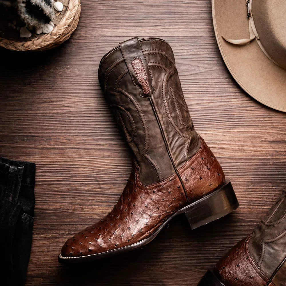 Brown ostrich skin cowboy boot shown with red leather interior lining visible