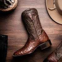 Brown ostrich skin cowboy boot shown with red leather interior lining visible