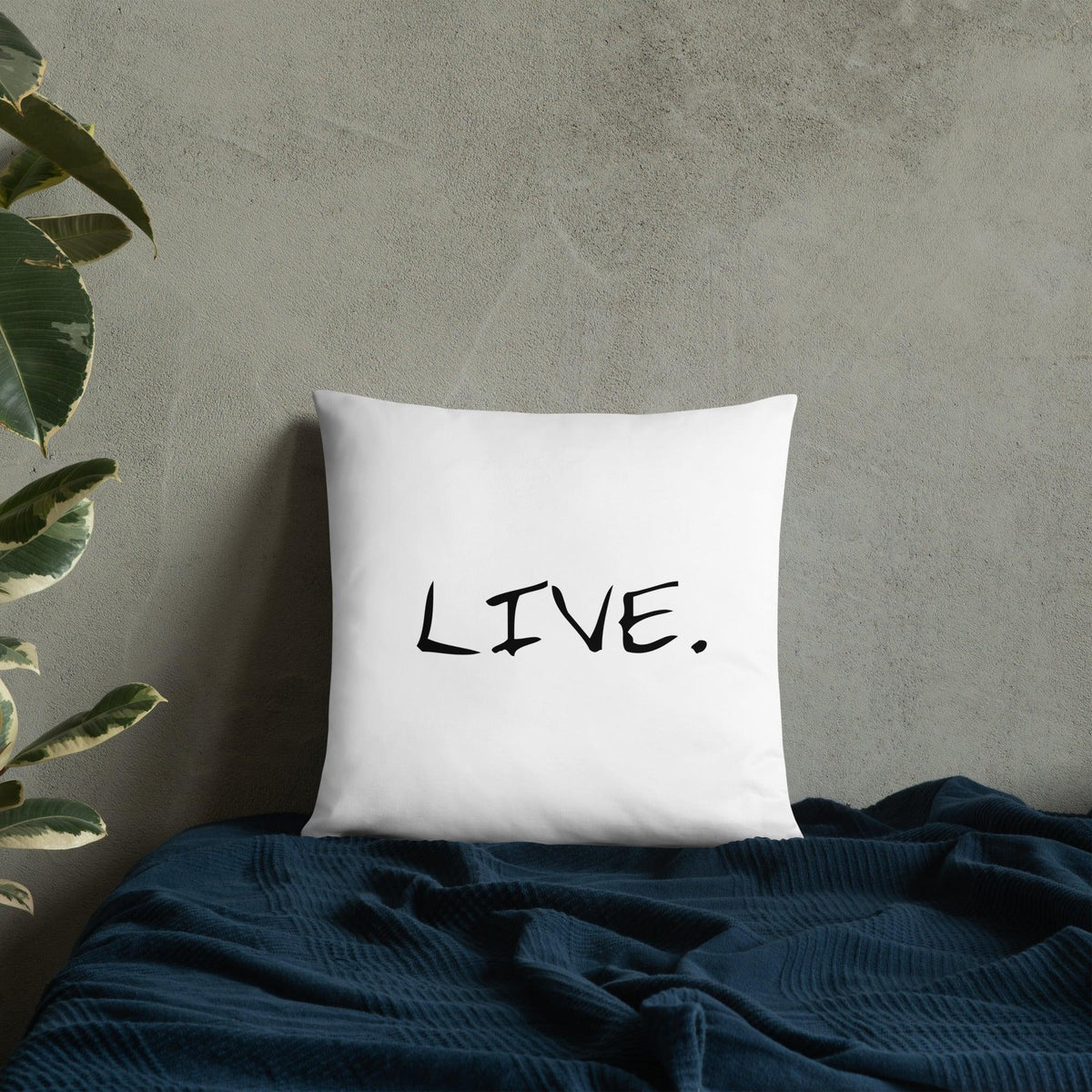 Back side of white pillow showing hidden zipper detail on a beige chair