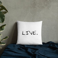Back side of white pillow showing hidden zipper detail on a beige chair