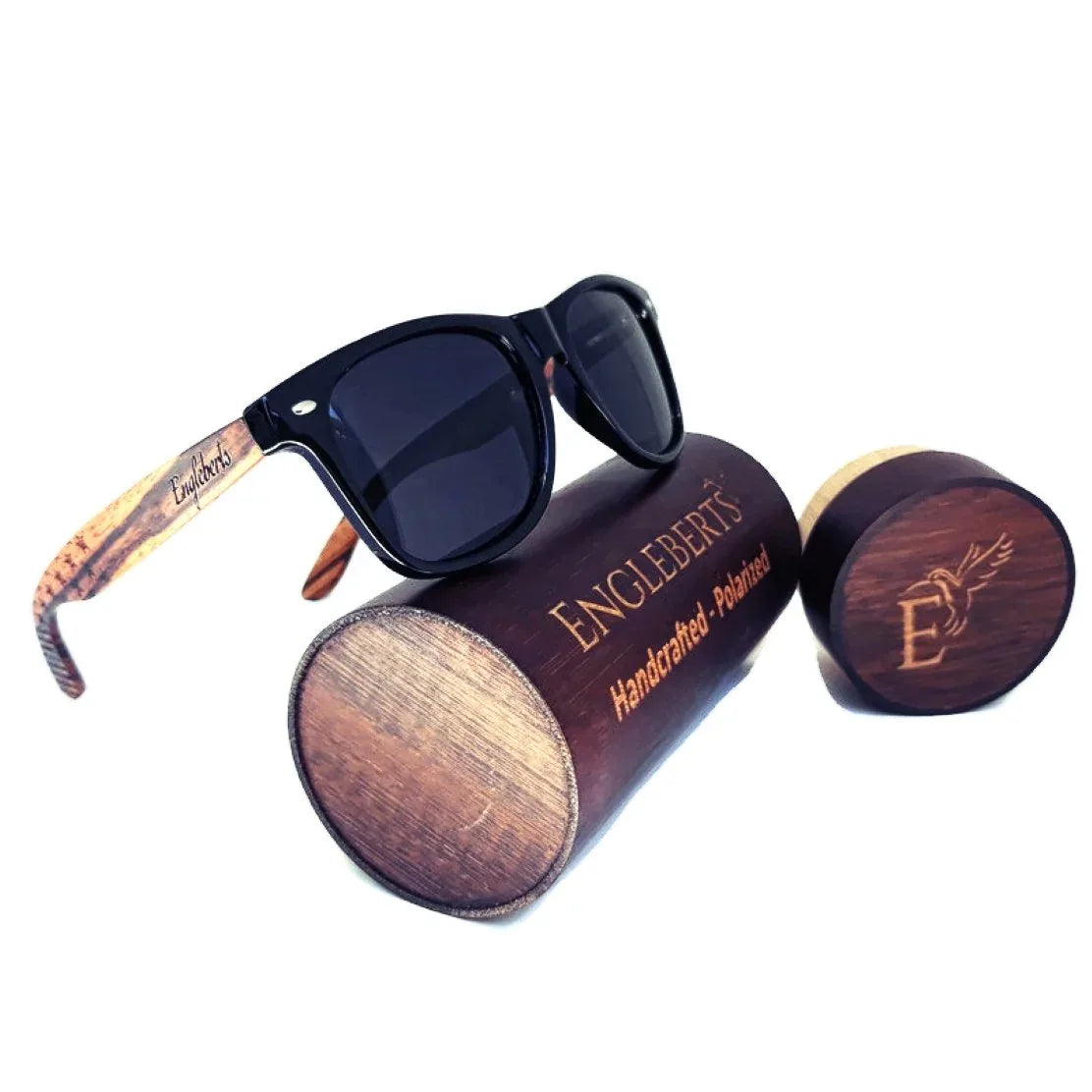 Zebrawood sunglasses with stars and stripes design displayed alongside wooden bamboo case and accessories