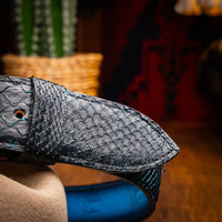 Lifestyle image of model wearing Arkansas belt with casual outfit, highlighting belt texture