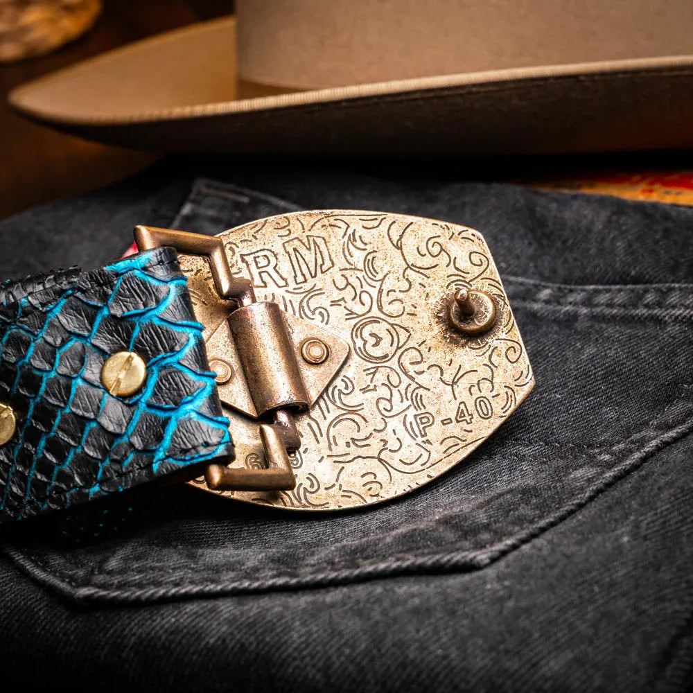 Close-up lifestyle photo showing Arkansas belt on person with hand near buckle
