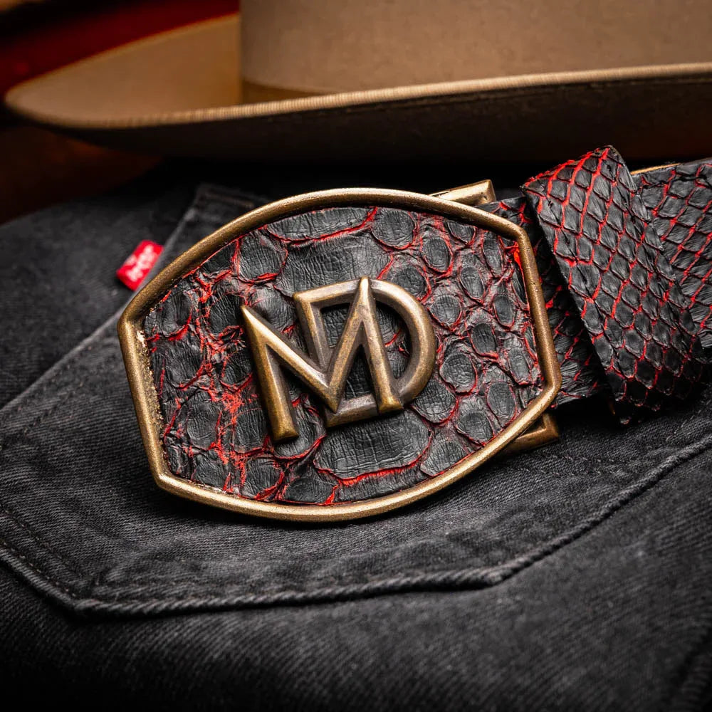 Close-up lifestyle image emphasizing exotic python texture and craftsmanship of Arkansas belt.