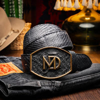 Model wearing Arkansas black python skin belt over jeans, styled with casual Western outfit