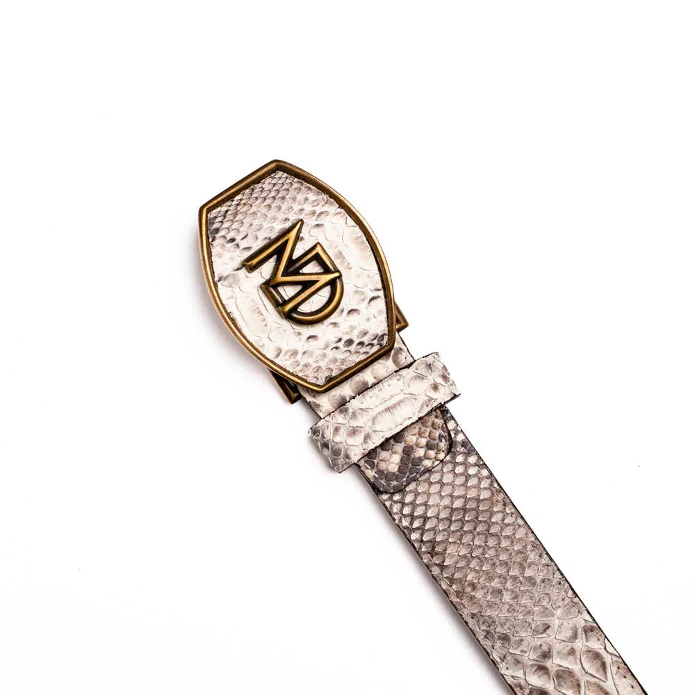 Arkansas python skin belt coiled on white background highlighting scale pattern and leather lining.