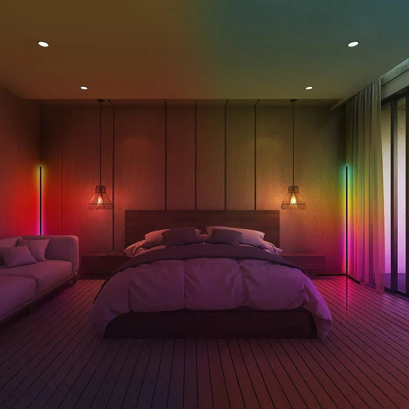 Close-up of RGB LED corner floor lamp glowing with vibrant multi-color lighting effects.