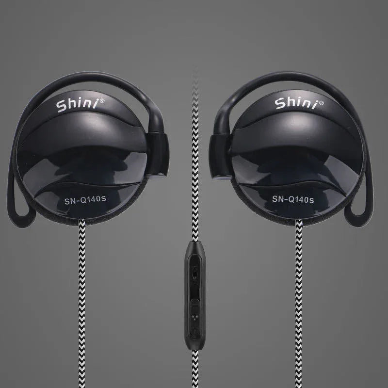 Cable and microphone close-up demonstrating inline control on black ear hook headphones.