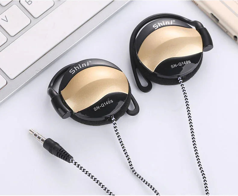 Side view of black ear hook headset highlighting ergonomic design and cable length.