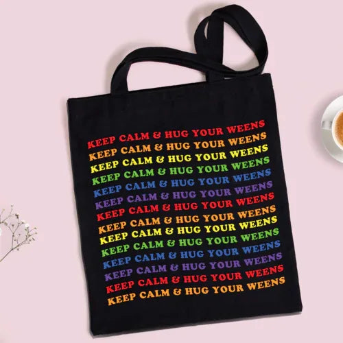 Keep Calm Wiener Dog Tote bag with red straps laid flat highlighting bright dog print on fabric.