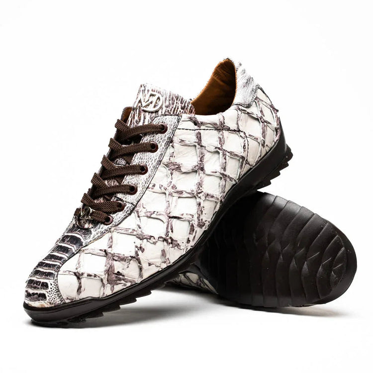 Close-up of Batistini sneaker showing overlapping Pirarucú skin scales and ostrich quill leather texture.