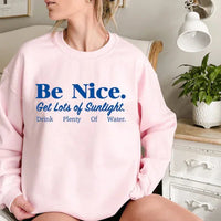 Light pink sweatshirt featuring vibrant, positive phrase about kindness and health