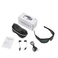 Black camcorder glasses with over-ear headphones displayed on white background.