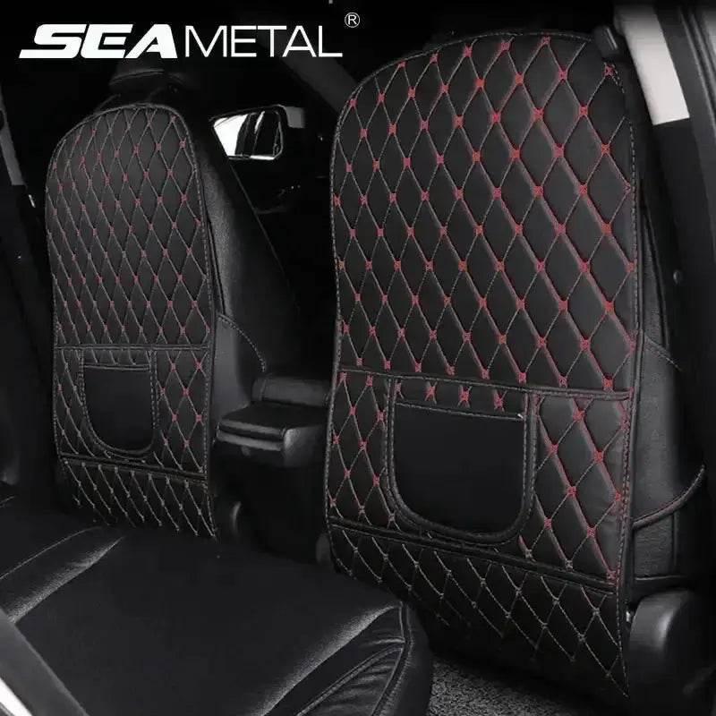 Black car seat protector pad with red stitching laid flat showing textured surface and water resistance.