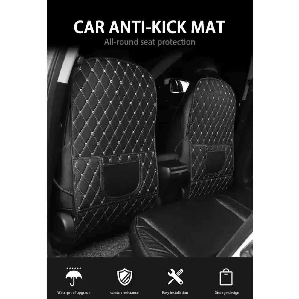 Top view of black car seat protector pad with red stitching fitted on car seat shielding fabric.