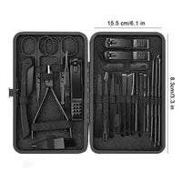 Manicure tools with matte black finish arranged inside matching black travel case.