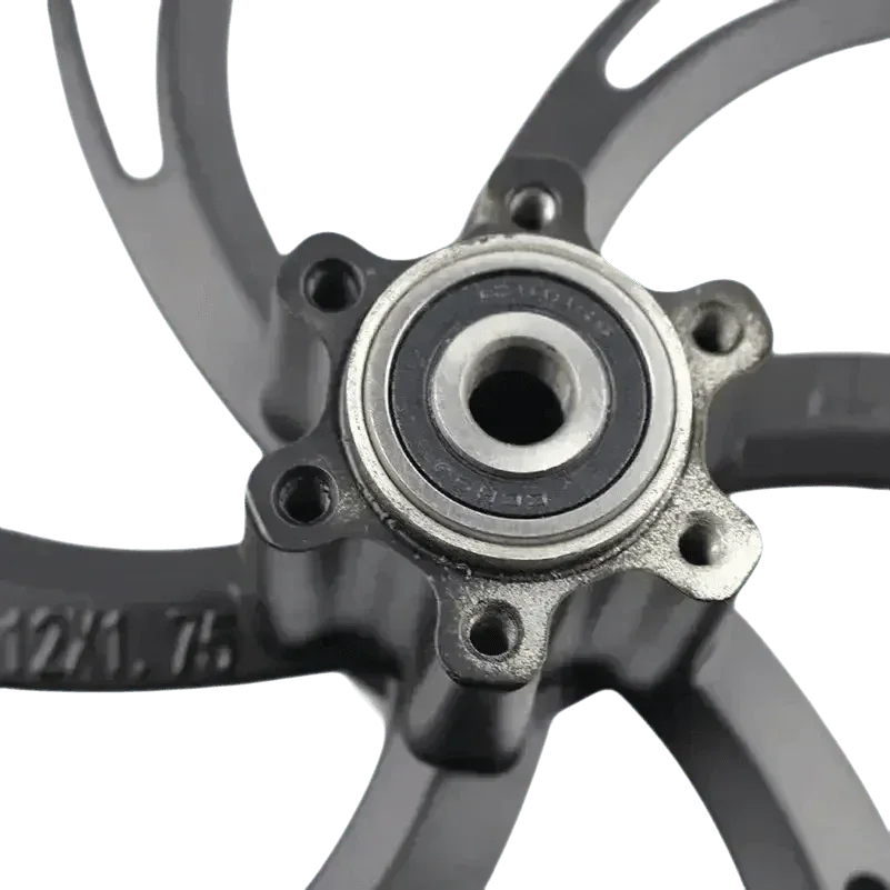 Front view of a black 12 inch motorcycle wheel hub for electric scooters, highlighting the center bearing.