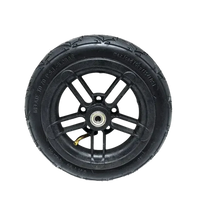 Black pneumatic tire for folding electric scooter showing tread and sidewall detail.
