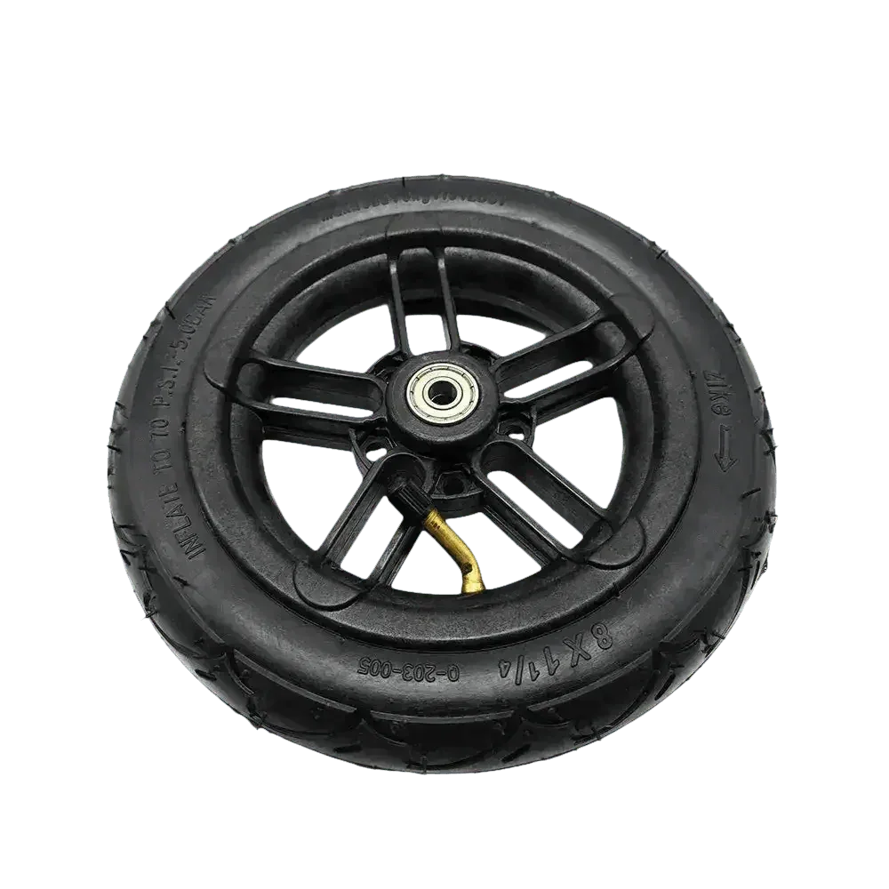 Black rubber folding electric scooter tire resting on white background with clear tread lines.