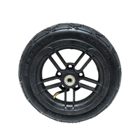 Pneumatic wheel with black tire mounted on folding electric scooter rim.