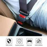 Close-up of seat belt extender’s red latch with safety lock mechanism.
