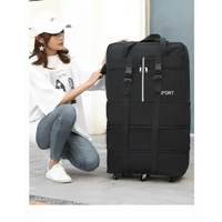 Black rolling luggage bag shown partly folded to highlight foldable feature and ease of storage.