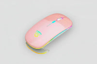 Black USB rechargeable RGB LED wireless mouse next to a pink keyboard.