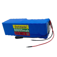 Side view of blue scooter battery pack showing power cables and connection port.