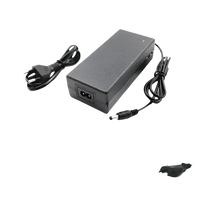 Side view of black and blue 54.6V lithium-ion battery pack for e-bike with charger on white backdrop.
