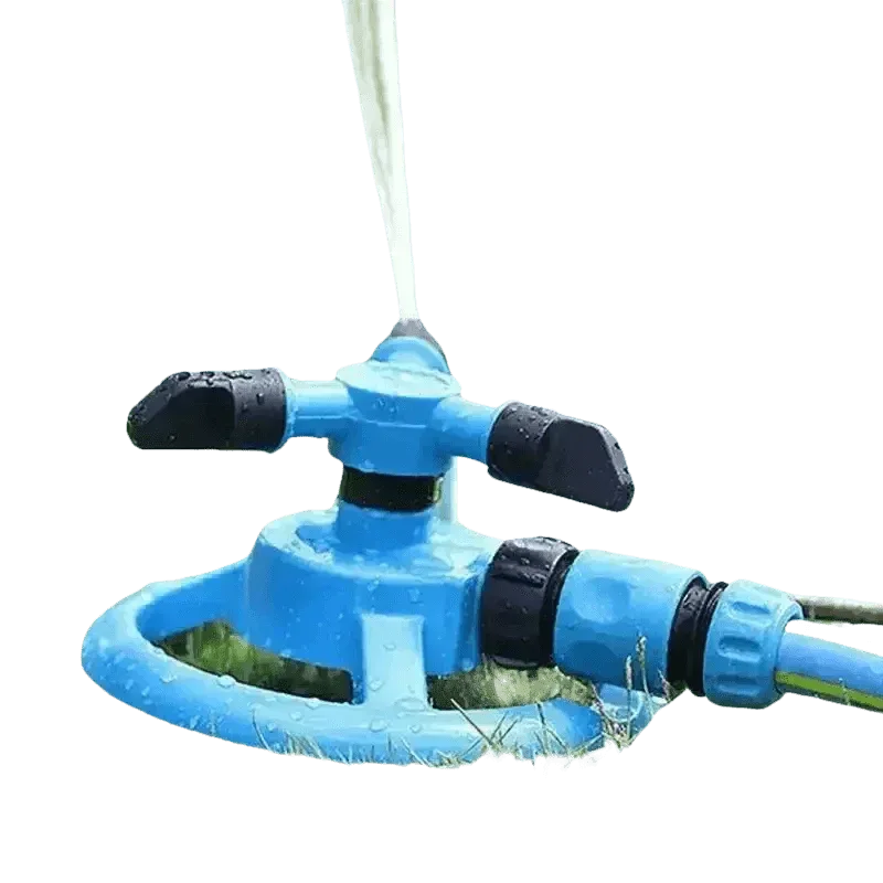 Blue automatic rotating garden sprinkler spraying water over green grass on sunny day.