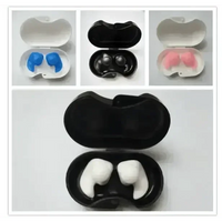 Blue silicone earplugs displayed individually with focus on water-resistant surface.