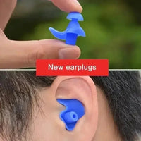 Blue silicone earplugs stacked, highlighting their soft, hypoallergenic texture.