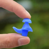 Pair of blue silicone hypallergenic earplugs designed for water sports on white background.