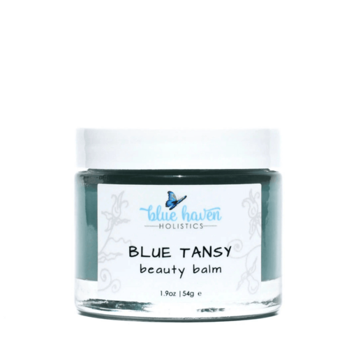 Blue Tansy Serenity Balm jar with botanical illustrations on label and blue accents