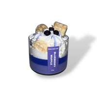 Close-up of a Blueberry Waffle Decorative Candle shaped like a breakfast waffle topped with blueberries.
