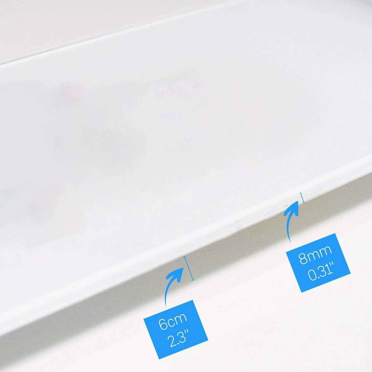 Close-up of skateboard width measurement with dinosaur design visible
