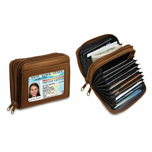 Brown genuine leather credit card wallet for women with zipper and butterfly detail on white.