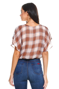 Side angle of plaid blouse highlighting flutter sleeve and tie-front detail.