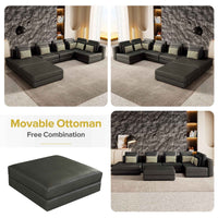 Large black modular sectional sofa with chaise lounge, upholstered in fabric, shown in a spacious living room.